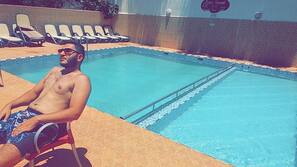 Outdoor pool, pool umbrellas, pool loungers