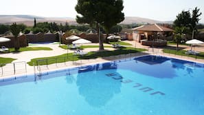 Seasonal outdoor pool, open 11:00 AM to 7:30 PM, pool umbrellas