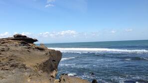 Private beach nearby, black sand