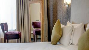 Premium bedding, desk, laptop workspace, iron/ironing board