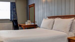 Premium bedding, desk, laptop workspace, iron/ironing board