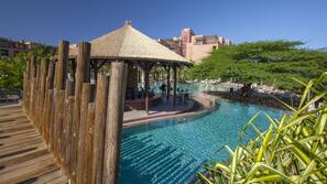 8 outdoor pools, pool umbrellas, pool loungers