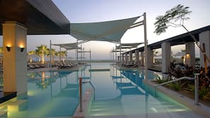 Outdoor pool, open 7 AM to 9 PM, pool umbrellas