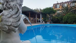 Seasonal outdoor pool, pool umbrellas, sun loungers