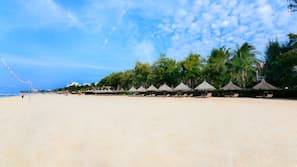 Private beach, white sand, sun loungers, beach umbrellas
