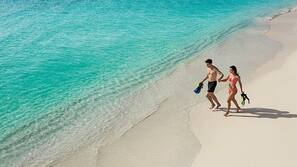 Private beach, white sand, sun loungers, beach towels
