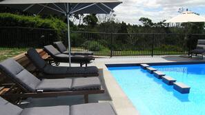Outdoor pool, pool umbrellas, pool loungers