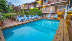 Outdoor pool, pool umbrellas, pool loungers