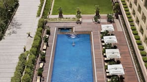 Outdoor pool, open 6:30 AM to 10:00 PM, pool umbrellas, pool loungers