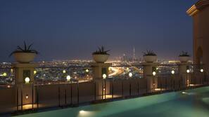 2 outdoor pools, open 7:00 AM to 10:00 PM, pool loungers