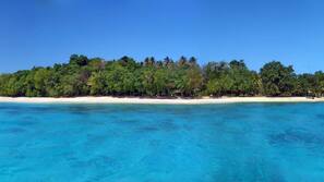 Private beach, white sand, sun-loungers, beach umbrellas