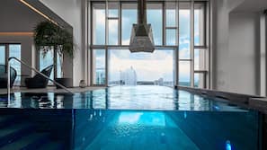 2 indoor pools, open 6 AM to 10 PM, pool loungers