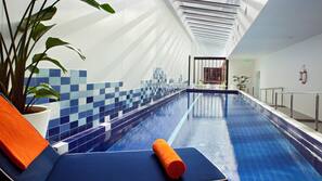 Indoor pool, open 5:00 AM to 10:00 PM, pool loungers
