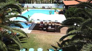 2 outdoor pools, pool umbrellas, pool loungers