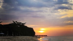 Private beach, white sand, sun loungers, beach umbrellas