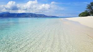 Private beach, white sand, sun loungers, beach umbrellas