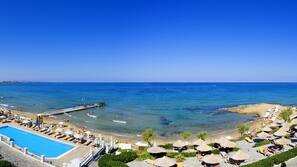 White sand, sun-loungers, beach umbrellas, beach towels