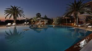 Seasonal outdoor pool, open 9:00 AM to 8:00 PM, pool umbrellas