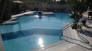 Seasonal outdoor pool, pool loungers