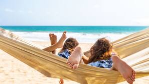 On the beach, beach cabanas, sun loungers, beach umbrellas