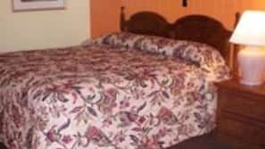 Desk, iron/ironing board, bed sheets, alarm clocks