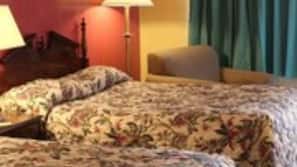 Desk, iron/ironing board, bed sheets, alarm clocks