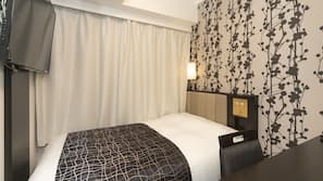 Blackout curtains, iron/ironing board, free WiFi, linens