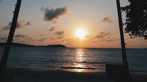 On the beach, sun-loungers, beach umbrellas, beach towels