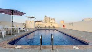 Outdoor pool, pool umbrellas, sun loungers