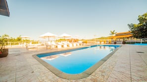 Outdoor pool, open 9 AM to 10 PM, pool umbrellas, pool loungers