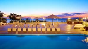 Outdoor pool, open 9 AM to 10 PM, pool umbrellas, pool loungers