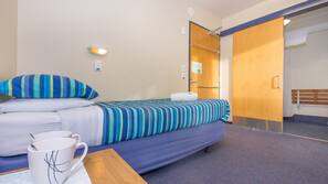 Blackout curtains, iron/ironing board, free WiFi, linens