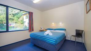 Blackout curtains, iron/ironing board, free WiFi, linens
