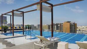 Outdoor pool, pool umbrellas, pool loungers