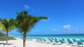 Private beach, white sand, sun loungers, beach towels