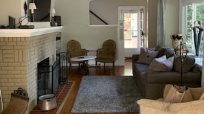 TV, fireplace, books