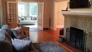 TV, fireplace, books