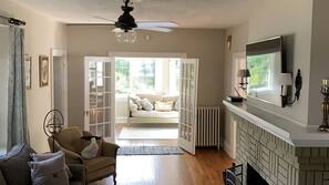 TV, fireplace, books