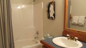 Combined shower/tub, towels, soap, shampoo