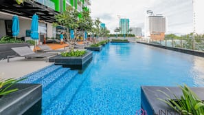 Outdoor pool, open 8:00 AM to 8:00 PM, pool umbrellas, pool loungers