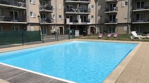 Seasonal outdoor pool, pool umbrellas, pool loungers