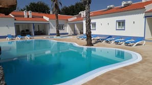 Outdoor pool, open 8:00 AM to midnight, pool loungers