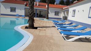 Outdoor pool, open 8:00 AM to midnight, pool loungers