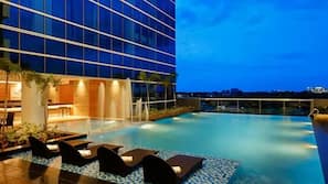 Outdoor pool, pool loungers, lifeguards on site