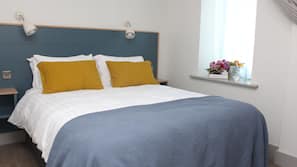 Premium bedding, blackout drapes, iron/ironing board, free WiFi