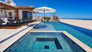Outdoor pool, pool umbrellas, sun loungers