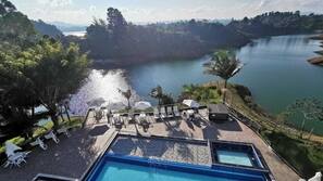 Outdoor pool, open 9:00 AM to 8:00 PM, pool umbrellas, pool loungers