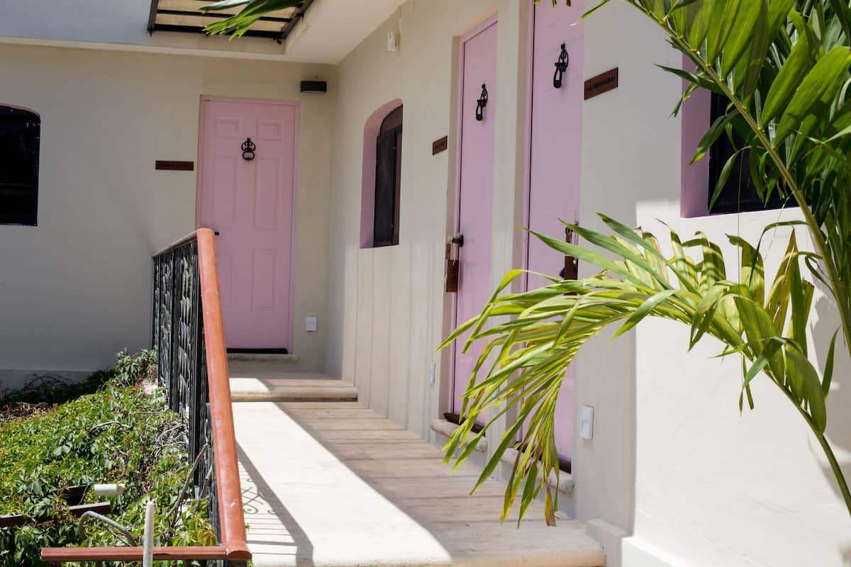 Kuka y Naranjo Boutique Hotel rooms with pink doors