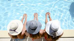 Outdoor pool, pool umbrellas, sun loungers