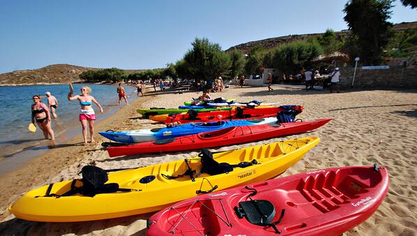 On the beach, white sand, sun loungers, beach umbrellas